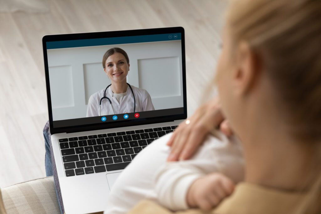 SOLUTIONS METRIX photo, Close up of young mother have webcam call with doctor